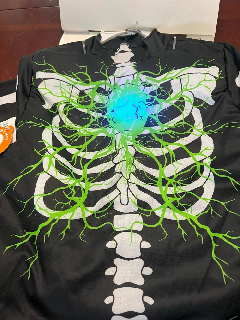 Hyde & EEK! Kids Black Light-Up Skeleton Costume with Glowing Chest (S 6-7)